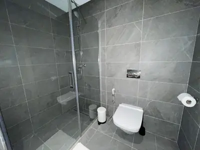 a bathroom with a shower and a toilet in it at Charmant studio avec vue sur mer in Rabat