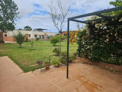 a garden with a pergola in a yard at premium farmhouse with pool Rabat in Rabat