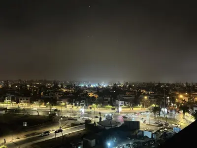 a city at night with cars and lights at Chic Apartment in Casa Finance District -Open view - Fast WIFI in Casablanca