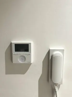 a wall with a urinal and a phone on a wall at Chic Apartment in Casa Finance District -Open view - Fast WIFI in Casablanca