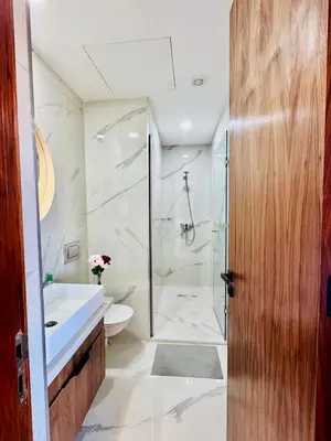 a bathroom with a shower and a toilet and a sink at Chic Apartment in Casa Finance District -Open view - Fast WIFI in Casablanca