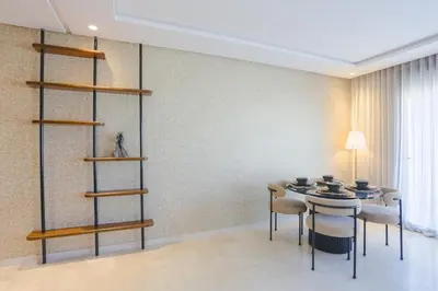 a dining room with a table and chairs at Résidence Tour 33 - CFC district in Casablanca
