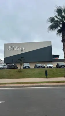 a car dealership with cars parked in front of it at Chill by Sea-Relaxing Stay with a View in Rabat