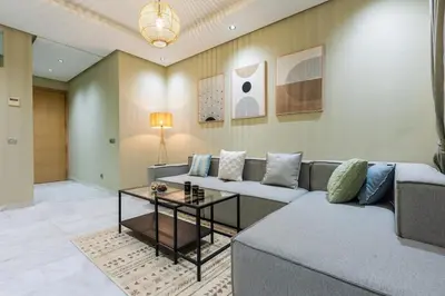 a living room with a couch and a table at Modern & Chic APT Prestigia by MERAT HOME in Rabat