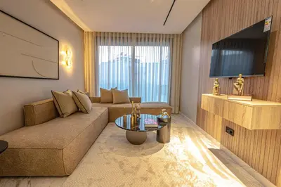 a living room with a couch and a table at New - Cosy central Casablanca apartment in Casablanca