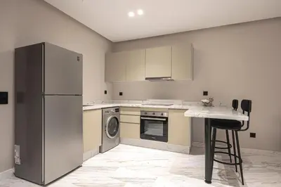 a kitchen with a refrigerator and a dishwasher at New - Cosy central Casablanca apartment in Casablanca