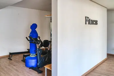 a room with a gym with blue equipment in it at BlueVista - Yacht like Escape with Ocean Views in Rabat