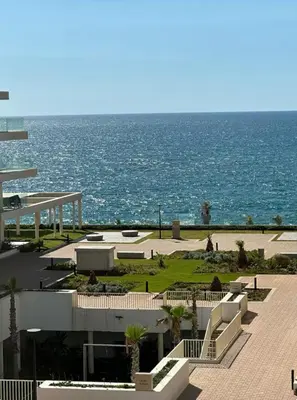 a view of the ocean from a building at La perle du carrousel in Rabat