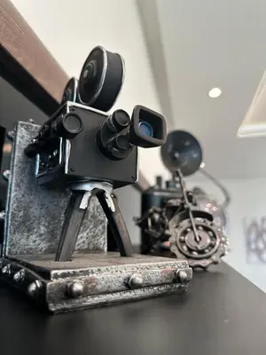 a camera on a table next to a motorcycle at Spacious Apartment 3BR by CH Hay riad, Rabat in Rabat