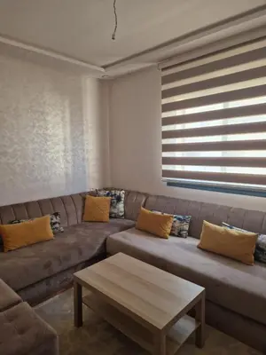 a living room with a couch and a coffee table at الشروق in Pont Blondin