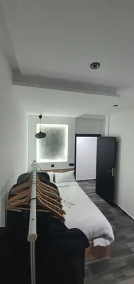 a bedroom with a large bed in a room at Cozy Apartement B-House Airport in Berrechid