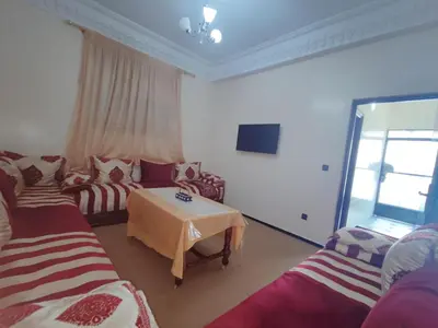 a living room with two couches and a table at de Luxe in Rabat