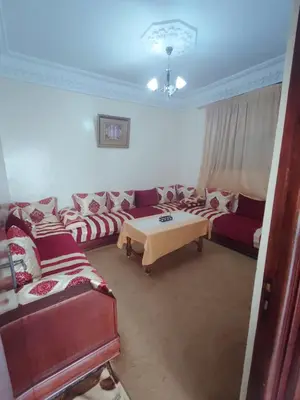a living room with couches and a table at de Luxe in Rabat