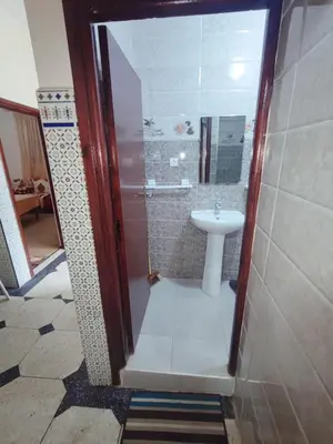 a small bathroom with a sink and a toilet at de Luxe in Rabat