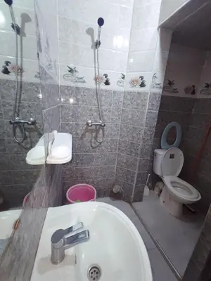 a bathroom with a sink and a toilet at de Luxe in Rabat