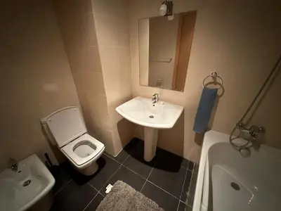 a bathroom with a sink and a toilet and a tub at Appartement haut standing Mohammedia Parc in Mohammedia