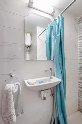 a bathroom with a sink and a mirror at Cozy studio moderne Agdal in Rabat