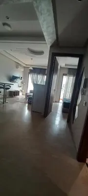 an empty living room with a table and a couch at Cozy 1BR 1BA Retreat in Casablanca