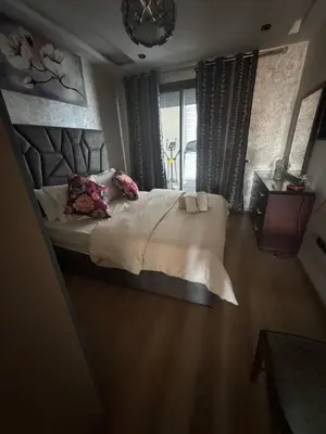 a bedroom with a large bed and a window at Appartement 3 chambres moderne a californie Casablanca in Casablanca
