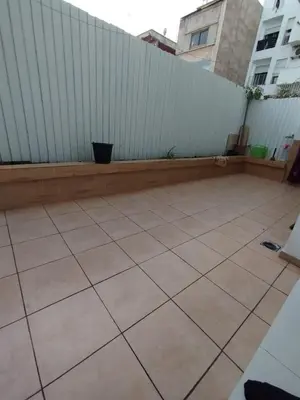 a patio with a white fence and a tiled floor at Cozy 1-BR with Large Terrace in Casablanca