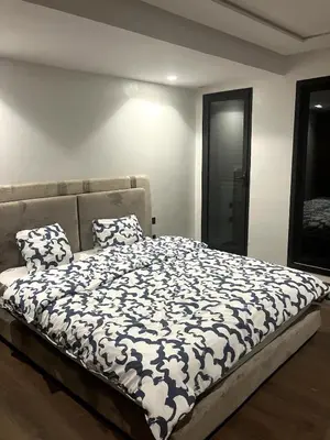a bed with two pillows on it in a room at Beachfront Villa in Dar Bouazza in Dar Bouazza