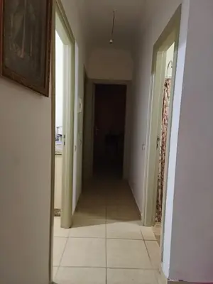 a hallway with a mirror in a room at Shams sidi rahal in Sidi Rahal