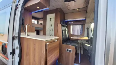 an interior view of an rv with a kitchen and a counter at J-L Camping Car Morocco in Casablanca