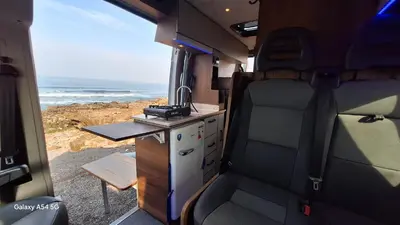 an interior view of an rv with a desk and a table at J-L Camping Car Morocco in Casablanca
