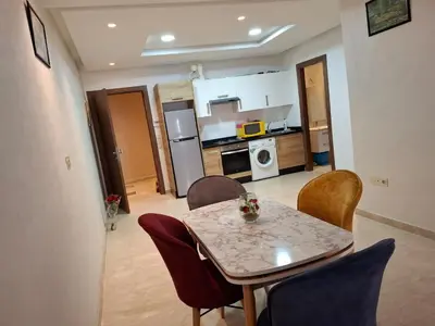 a kitchen and dining room with a table and chairs at Emma's Luxury Studio 36 in Casablanca