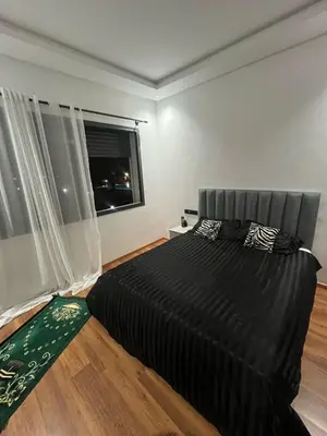 a bedroom with a bed and a window at Aymen beach in Mansouria
