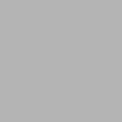 a living room with a green couch and a table at H2H standing in Temara