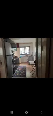 a view of a kitchen and a living room at Appartemment à Rabat Agdal Avenue de France in Rabat