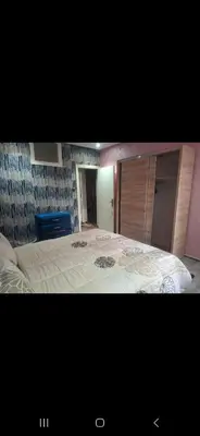 a bedroom with a large bed in a room at Appartemment à Rabat Agdal Avenue de France in Rabat