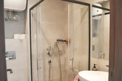 a shower with a glass door in a bathroom at Luxueux appartement - Bourgogne, Casablanca in Casablanca