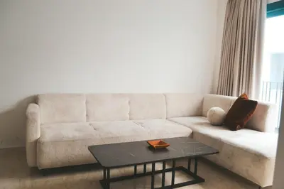 a living room with a couch and a table at Luxueux appartement - Bourgogne, Casablanca in Casablanca
