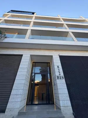 a building with a glass door in front of it at Studio Prestige CFC Casablanca in Casablanca
