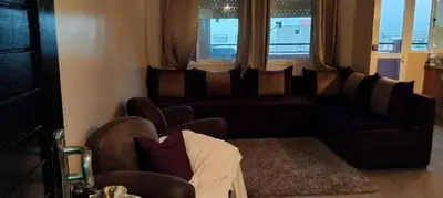 a living room with a couch and chairs and a window at Appart cozy proche de casa voyageur in Casablanca