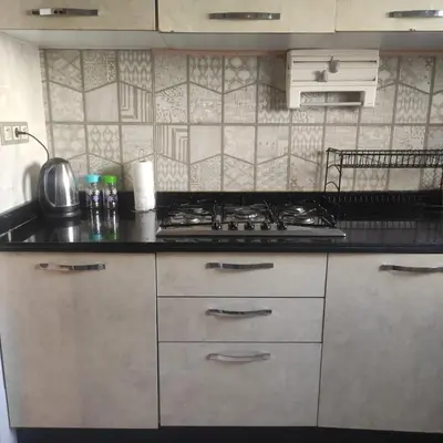 a kitchen with a stove and a counter top at Mounia Moon in Casablanca