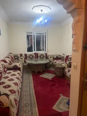 a living room with a couch and a table at Villa alex33 in Casablanca