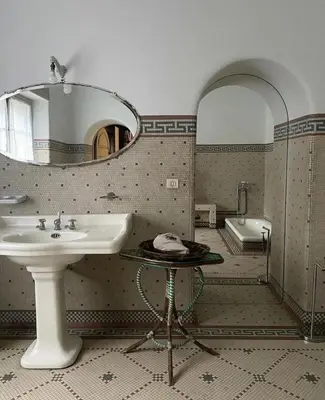 a bathroom with a sink and a mirror and a tub at Villa alex33 in Casablanca