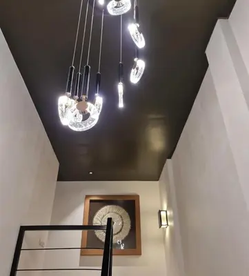 a room with several lights hanging from a ceiling at Villa alex33 in Casablanca
