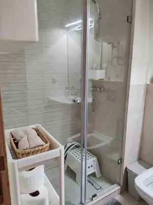 a bathroom with a glass shower and a sink at Beautiful apartment in the heart of Zenata in Aïn Harrouda