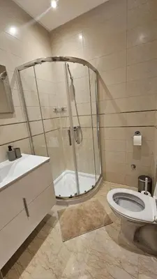 a bathroom with a shower and a toilet and a sink at Apartment with terrace - Strategic location in Casablanca