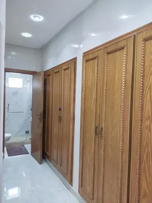 a row of wooden lockers in a bathroom at Apart 3ch 2sdb salon Centre ville in Casablanca