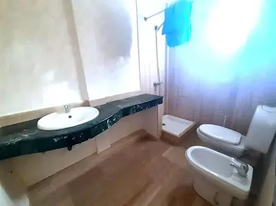 a bathroom with a sink and a toilet at Appartement 380M BD El Massira Maarif in Casablanca