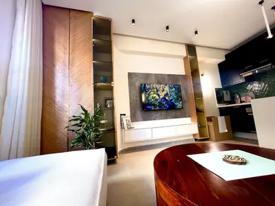 a living room with a table and a painting on the wall at Cozy apartment Casablanca in Casablanca