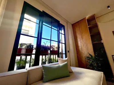 a room with a couch and a large window at Cozy apartment Casablanca in Casablanca