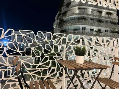 a wall with a table and a building at Sunshine Apartment in Casablanca
