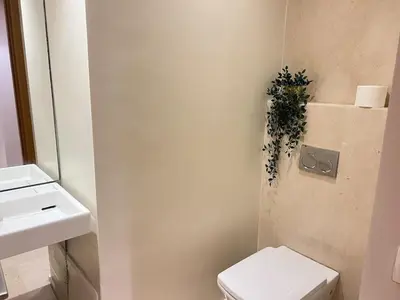 a bathroom with a toilet and a sink at Sunshine Apartment in Casablanca