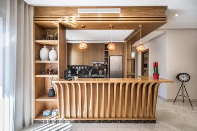 a kitchen with a wooden counter in a room at Contemporary apartment in CFC Anfa in Casablanca